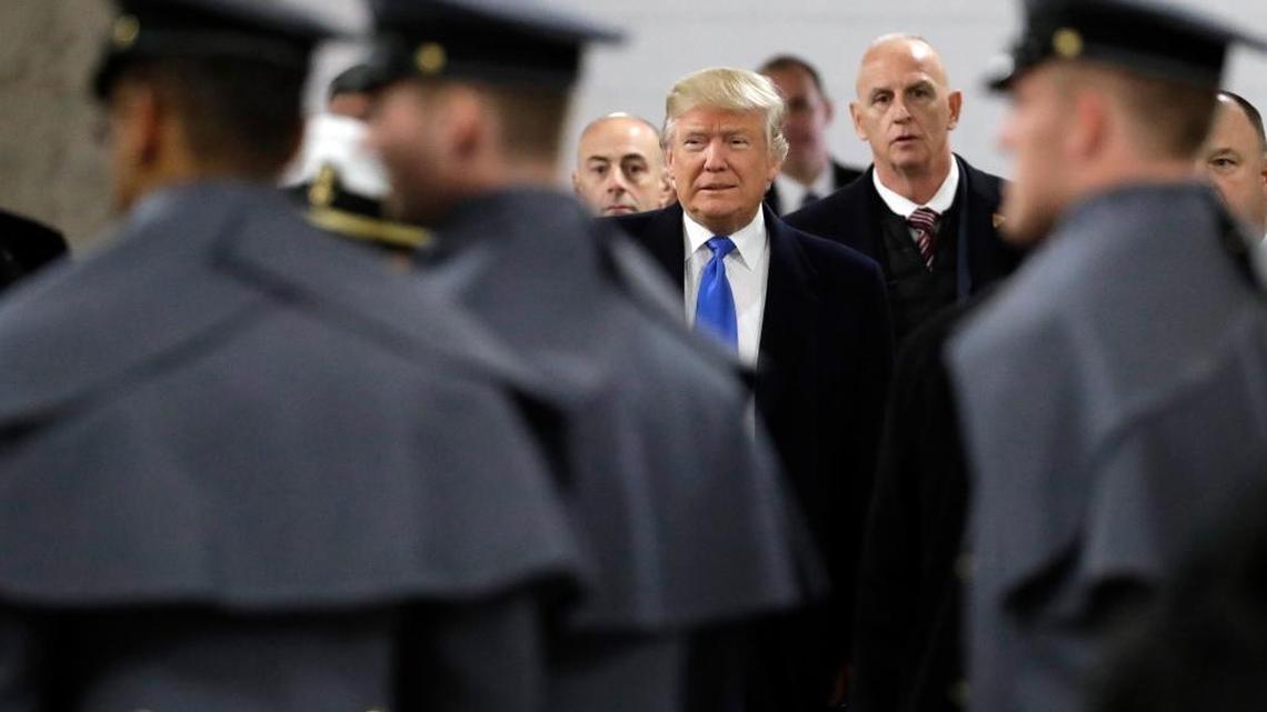 President-elect Donald Trump walks up to greet Army Cadets and Navy Midshipmen before the Army-Navy NCAA college football game in Baltimore, Saturday, Dec. 10, 2016. (AP Photo/Patrick Semansky)