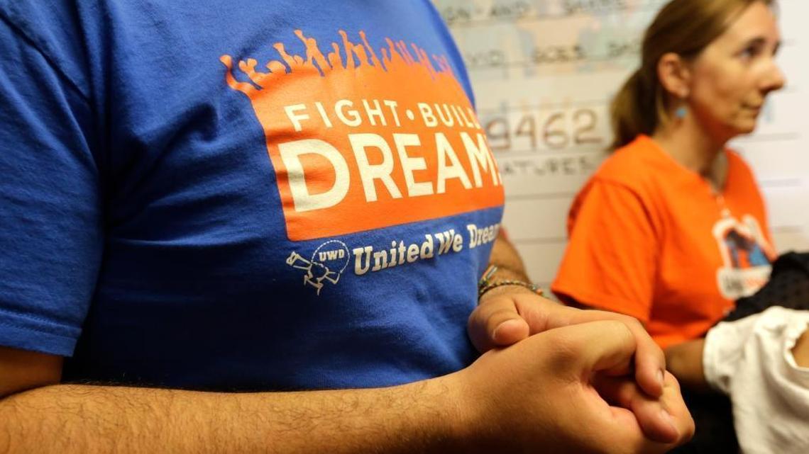 Ricardo Campos, of United We Stand, left, presents a petition asking lawmakers to help release a Nicaraguan asylum seeker who was detained after a routine check-in with U.S. Immigration and Customs Enforcement in South Florida, at the office of Congresswoman Ileana Ros-Lehtinen, Wednesday, April 19, 2017, in Miami. At right is Ros-Lehtinen's Chief of Staff Maytee Sanz.