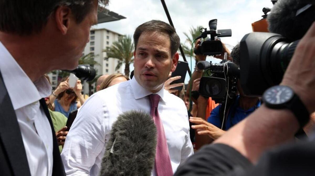 Florida Sen. Marco Rubio answers questions from the press after paying his respects to the victims of the Pulse nightclub shooting in Orlando last week.