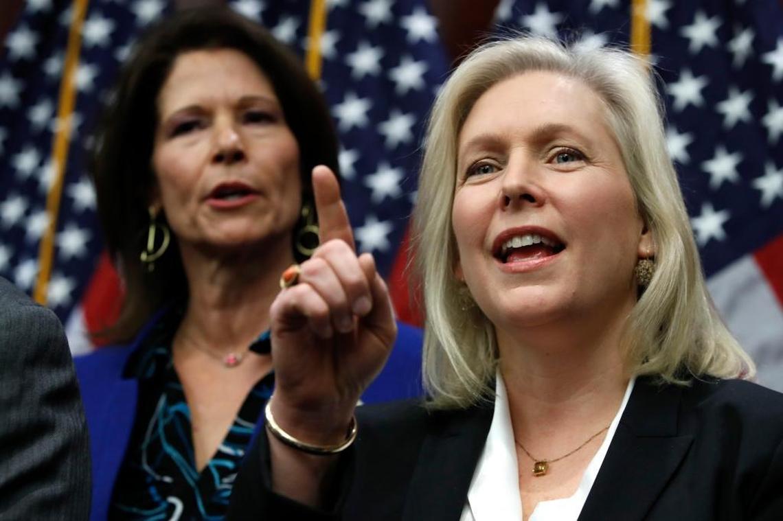 Sen. Kirsten Gillibrand, D-N.Y., right, answers a question during a news conference on sexual harassment.