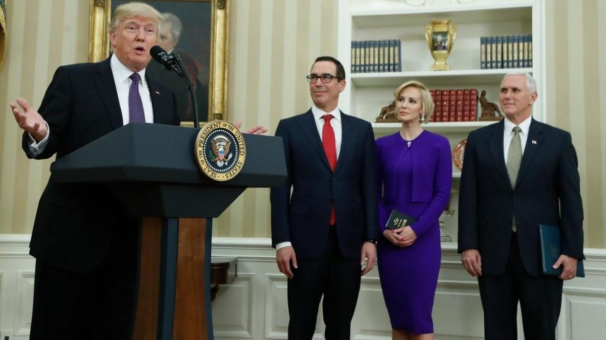 Vice President Mike Pence, far right, administers the oath of office to newly confirmed Treasury Secretary Steven Mnuchin on Feb. 13, 2017. Mnuchin was accompanied by his fiancée, Scottish actress Louise Linton. President Trump made remarks before the oath was administered.