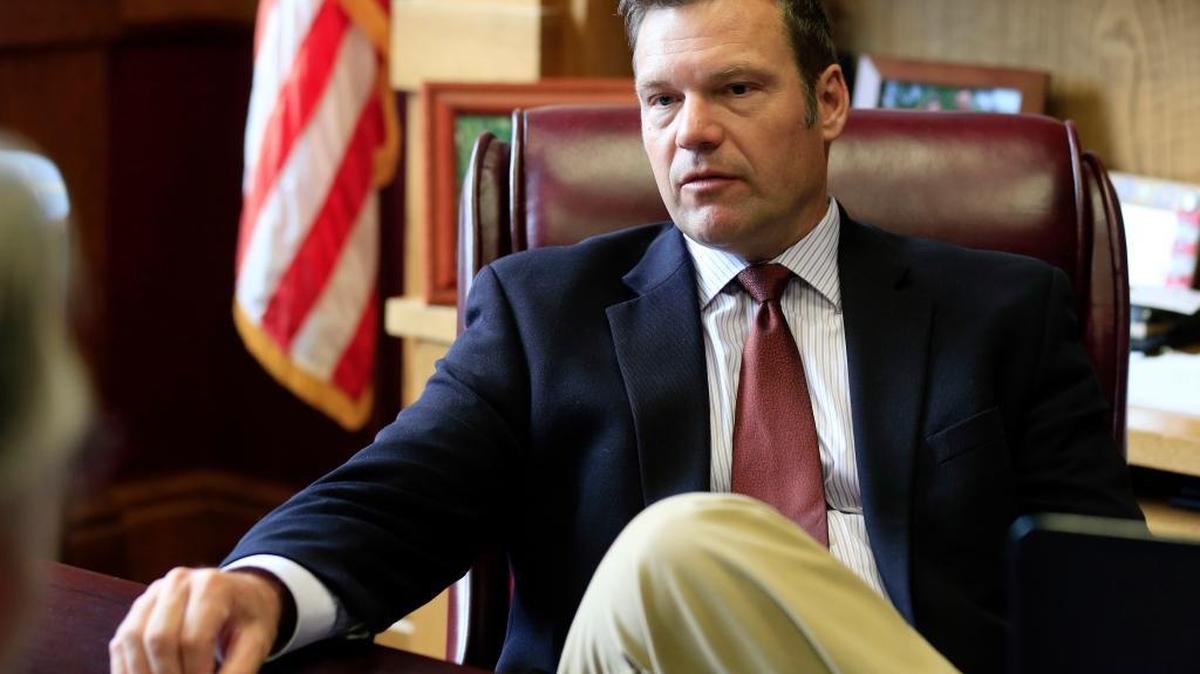 In this May 17, 2017, file photo, Kansas Secretary of State Kris Kobach talks with a reporter in his office in Topeka, Kan. Kobach, who is helping lead President Donald Trump's commission on election fraud announced Thursday, June 8, 2017, that he's running for the Republican nomination for governor.