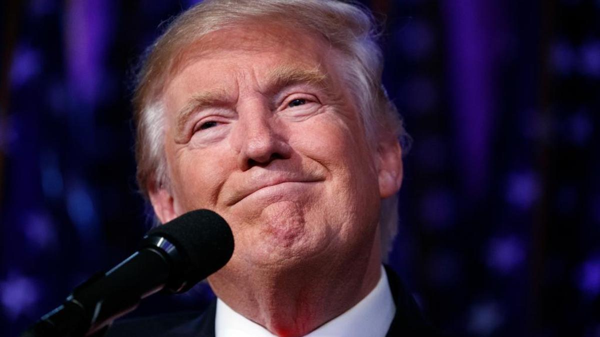 In this Wednesday, Nov. 9, 2016 file photo, President-elect Donald Trump smiles as he arrives to speak at an election night rally, in New York.