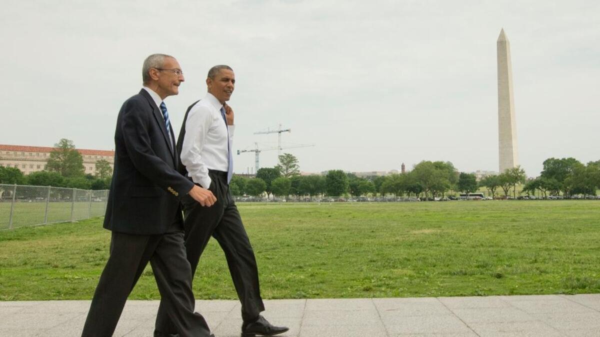 President Barack Obama and White House counselor John Podesta in Washington in 2014. Their email exchanges were released by WikiLeaks on Thursday.