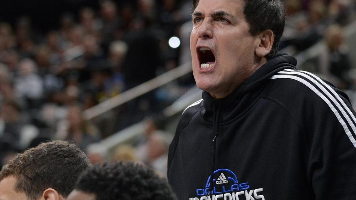 Dallas Mavericks owner Mark Cuban yells at an official during the second half of an NBA basketball game against the San Antonio Spurs, Jan. 17, 2016, in San Antonio.