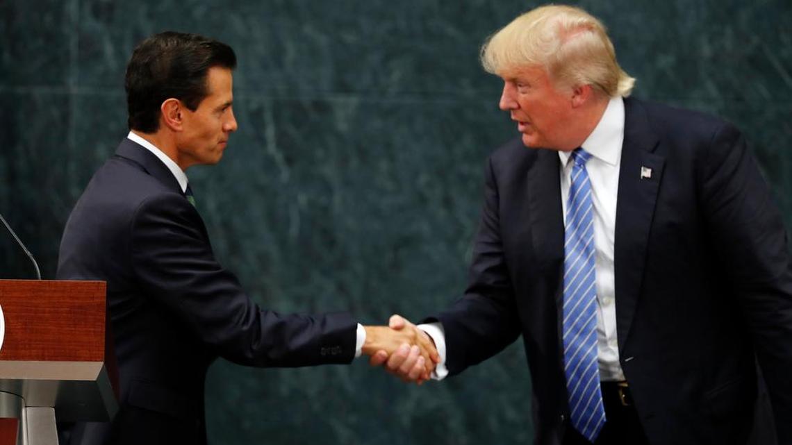 Mexico President Enrique Peña Nieto and Republican presidential nominee Donald Trump shake hands after a joint statement at Los Pinos, the presidential official residence, in Mexico City on Wednesday. Trump is calling his surprise visit to Mexico City a “great honor” and said after meeting with Peña Nieto that the pair had a substantive, direct and constructive exchange of ideas.