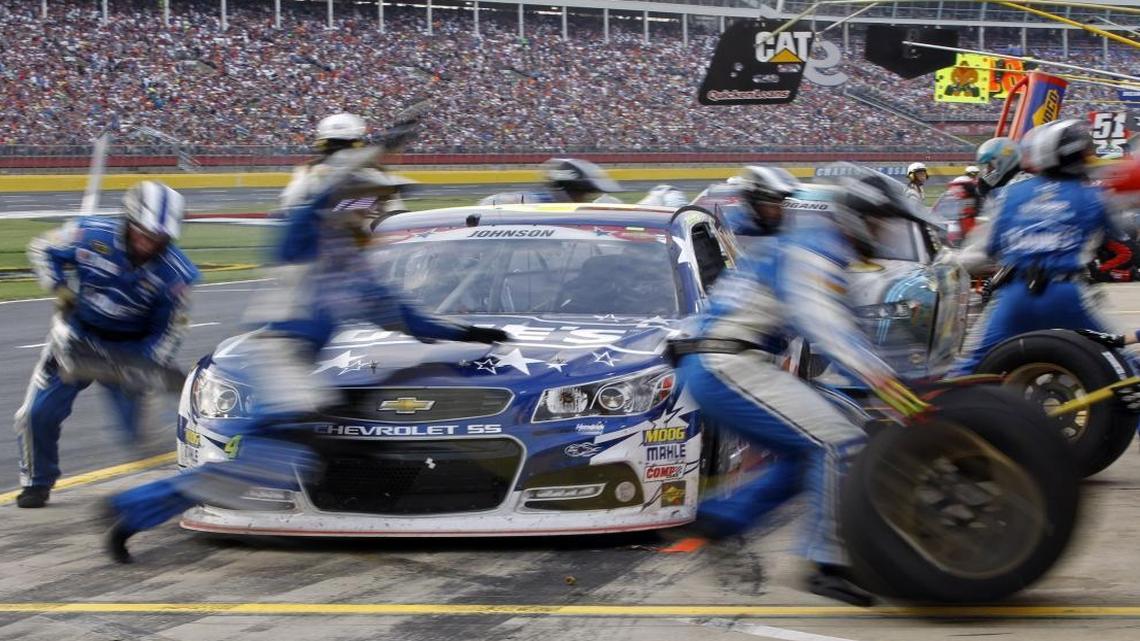FILE – Professional NASCAR drivers use cars already are exempt from the Clean Air Act but North Carolina Republicans want a new law to ensure federal environmental regulations don’t hurt amateur drivers. This photo was taken at a slow shutter speed as crew members perform a pit stop on driver Jimmie Johnson's car during the NASCAR Sprint Cup series Coca-Cola 600 auto race at Charlotte Motor Speedway in Concord, N.C., Sunday, May 25, 2014.