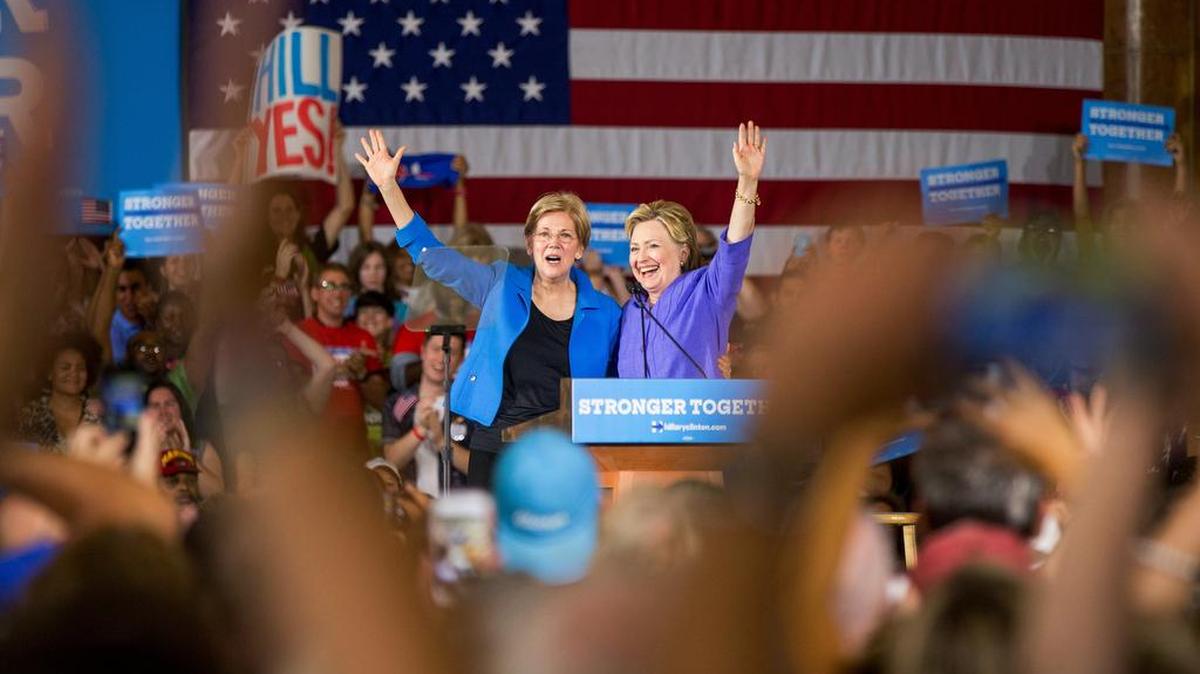 Democratic presidential candidate Hillary Clinton is introduced by Sen. Elizabeth Warren, D-Mass., left, at a rally at the Cincinnati Museum Center at Union Terminal in Cincinnati on Monday, June 27, 2016.