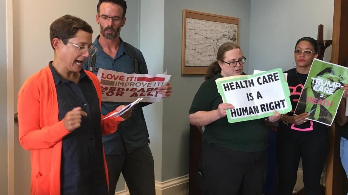 Kansas State University adjunct professor Jess Kerr speaks in Kansas Sen. Jerry Moran's office on Wednesday,about why the Affordable Care Act should not be repealed.