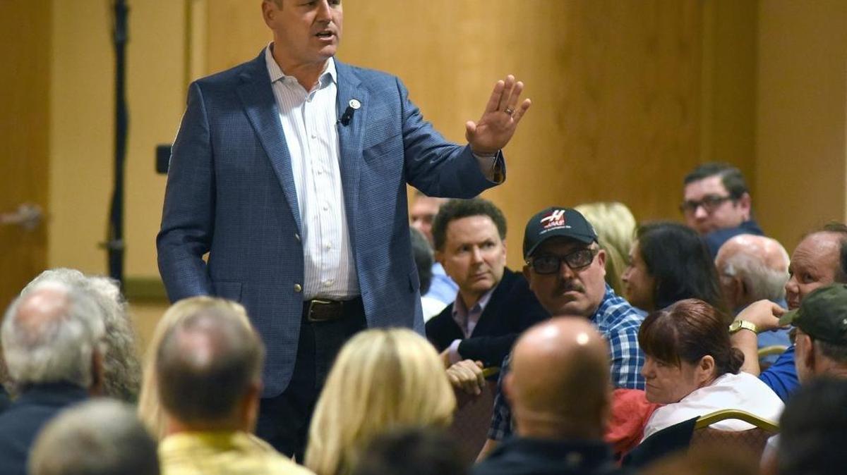 Rep. Jeff Denham, R-Turlock, addresses the crowd on April 17, 2017, during a crowded town hall meeting at Larsa Banquet Hall in Denair, Calif.
