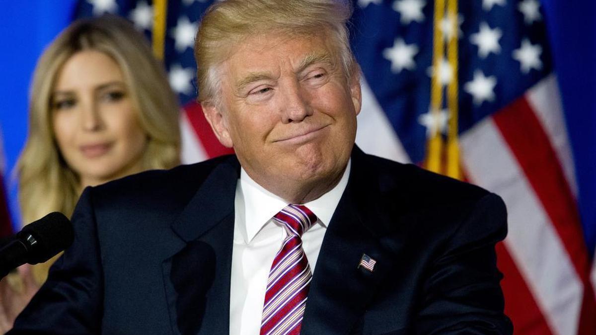 Republican presidential candidate Donald Trump smiles as supporters cheer during a news conference at the Trump National Golf Club Westchester on Tuesday in Briarcliff Manor, N.Y.