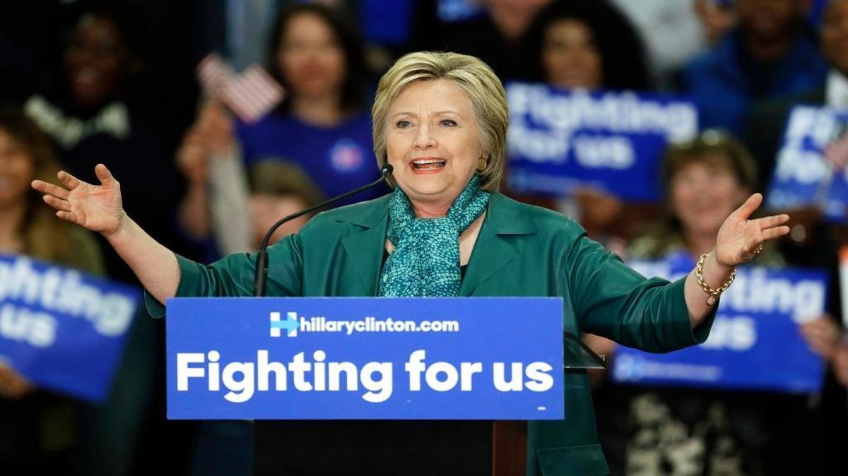 FILE - In this photo taken March 22, 2016, Democratic presidential candidate Hillary Clinton speaks during a campaign rally at Rainier Beach High School in Seattle. Tens of thousands of Democrats in Washington state will meet at schools, libraries and community centers at caucuses this weekend to voice their preference for the Democratic presidential nominee.