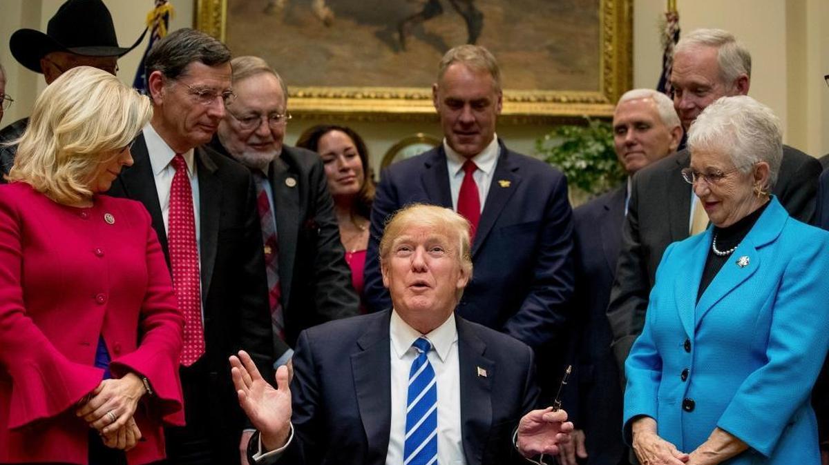 House education committee Chair Virginia Foxx, R-N.C., stands to the right of President Donald Trump on March 27, 2017, as he signs a law repealing Obama administration regulations on K-12 education. Also pictured, from left, Rep. Liz Cheney, R-Wyo., Sen. John Barrasso, R-Wyo., Rep. Don Young, R-Alaska, Lolita Zinke, her husband, Interior Secretary Ryan Zinke, Vice President Mike Pence and Sen. Ron Johnson, R-Wis.