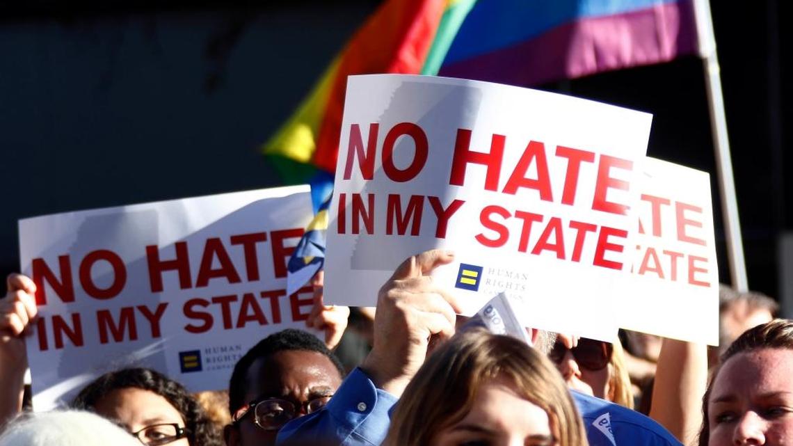 Protesters call for Mississippi Gov. Phil Bryant to veto House Bill 1523, which they say will allow discrimination against LGBT people, during a rally outside the Governor's Mansion in Jackson, Miss., on Monday, April 4, 2016.