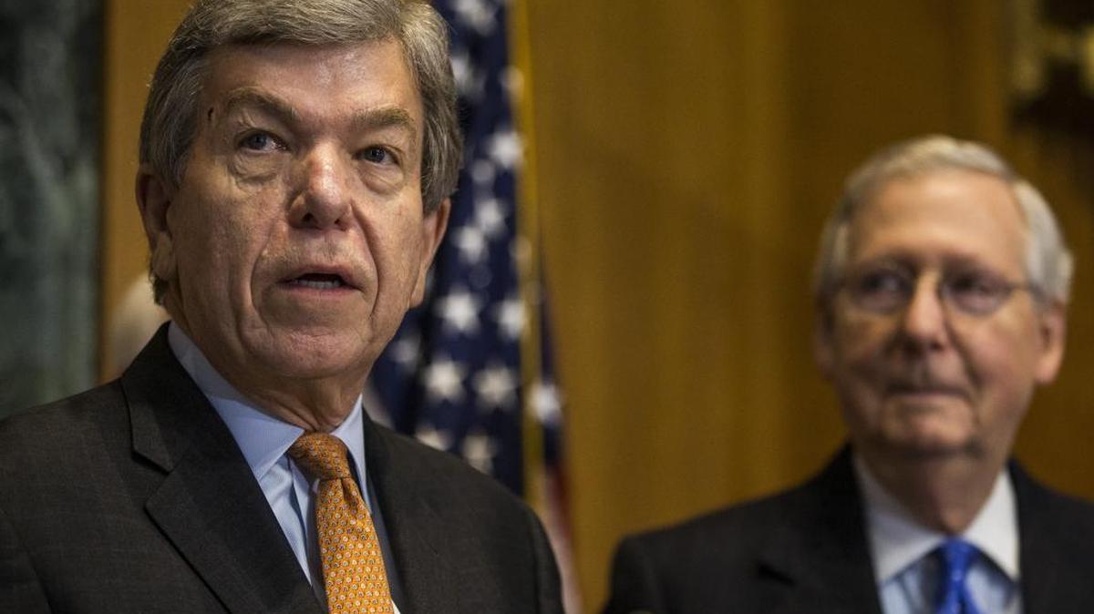 Sen. Roy Blunt (R-Mo.) speaks as Senate Majority Leader Mitch McConnell (R-KY) looks on during a news conference on proposed Republican tax legislation on Capitol Hill.