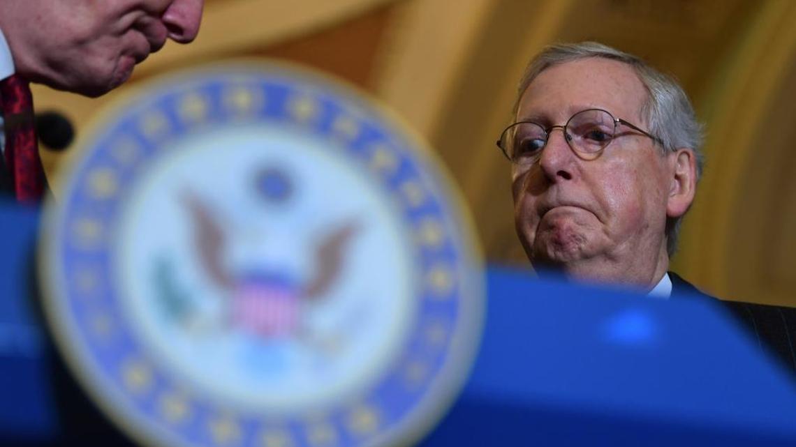 Senate Majority Leader Mitch McConnell of Ky., right, listens as Sen. John Cornyn, R-Texas, left, finishes speaking to reporters following the weekly Republican policy luncheon on Capitol Hill in Washington last week.