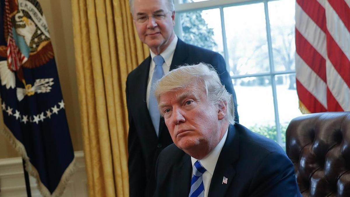 President Donald Trump with Health and Human Services Secretary Tom Price in the White House Oval Office last month. On Thursday, HHS finalized new rules designed to stabilize Obamacare insurance marketplaces. Critics say the rules favor insurers and weaken consumer protections.