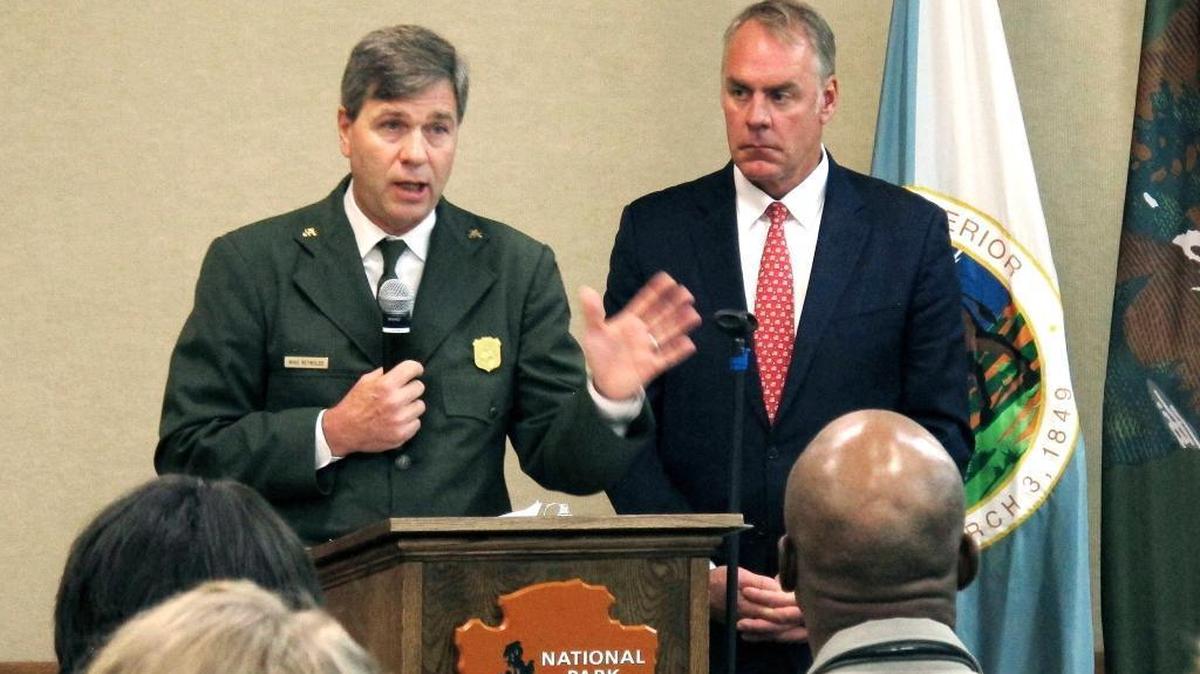 National Park Service acting director Mike Reynolds, left, and Interior Secretary Ryan Zinke address Park Service employees at Grand Canyon National Park, Ariz., on Friday, Oct. 13, 2017. A watchdog group has accused the Interior Department of illegally relying on temporary agency directors. Reynolds, for instance, served 386 days in an acting capacity, even though the law says the maximum tenure is only 300 days.