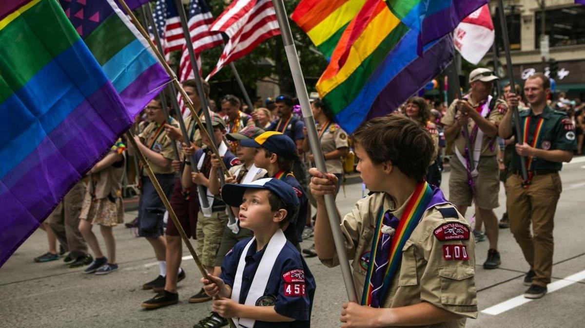Boy Scouts James Nyland, 9, in blue, and Christian Varenhorst, 10, right, carry rainbow flags at the 41st Annual Seattle Pride Parade in downtown Seattle on Sunday, June 28, 2015. Donald Trump’s secretary of state pick Rex Tillerson led the push to allow gays in Boy Scouts.