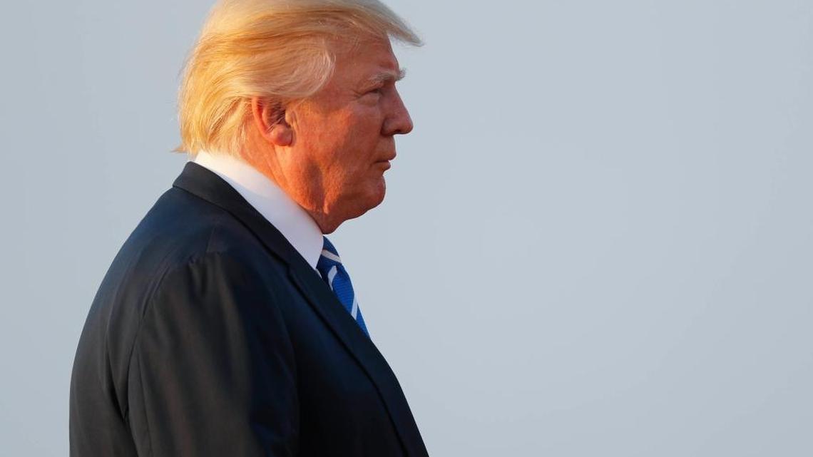 President Donald Trump heads to Air Force One at Morristown Municipal Airport for areturn flight to the Washington area.