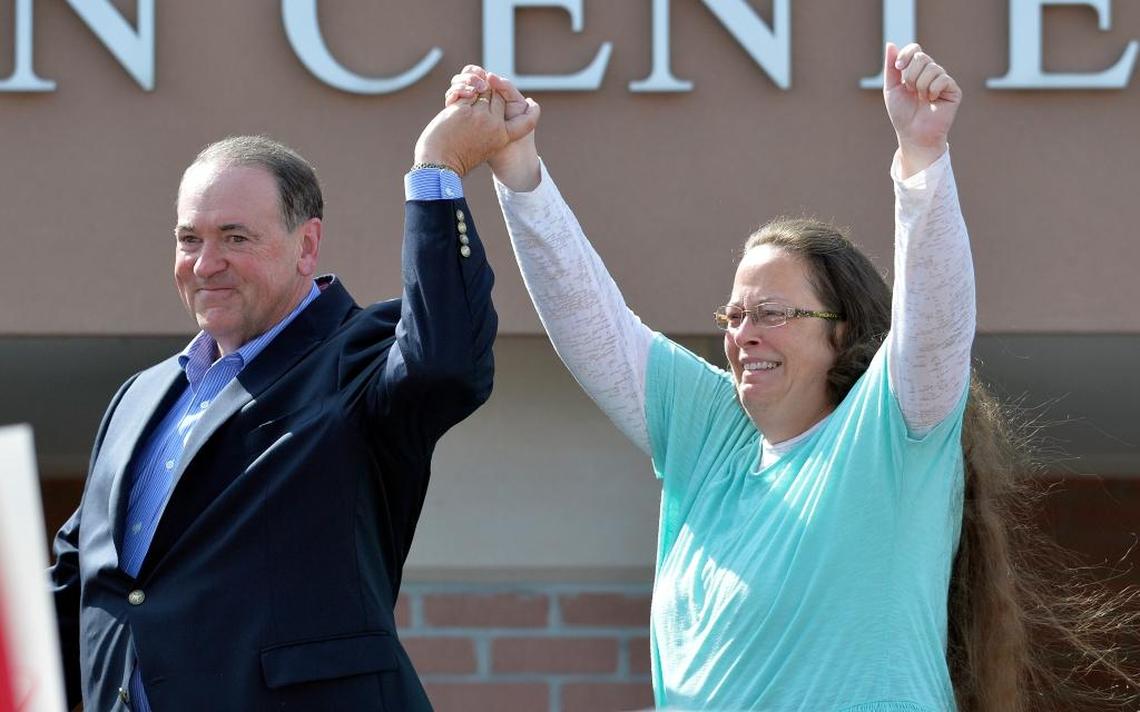 Rowan County Clerk Kim Davis, with Republican presidential candidate Mike Huckabee at her side, greets the crowd after being released from the Carter County Detention Center, in Grayson, Kentucky on Sept. 8.