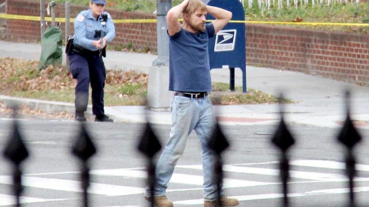 Edgar Maddison Welch, 28 of Salisbury, N.C., surrenders to police Dec. 4, 2016, in Washington. Welch, who said he was investigating a conspiracy theory about Hillary Clinton running a child sex ring out of a pizza place, fired an assault rifle inside the restaurant, injuring no one, police said.