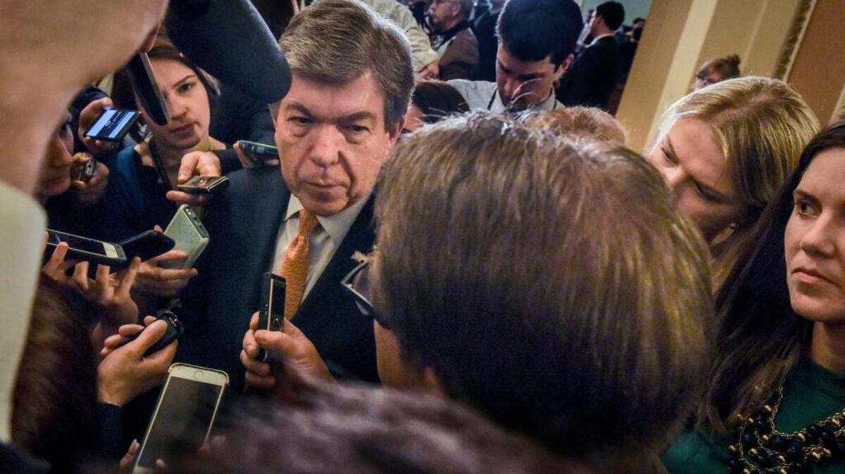 Sen. Roy Blunt, R-Mo., is swamped by reporters outside of Senate chambers Tuesday.