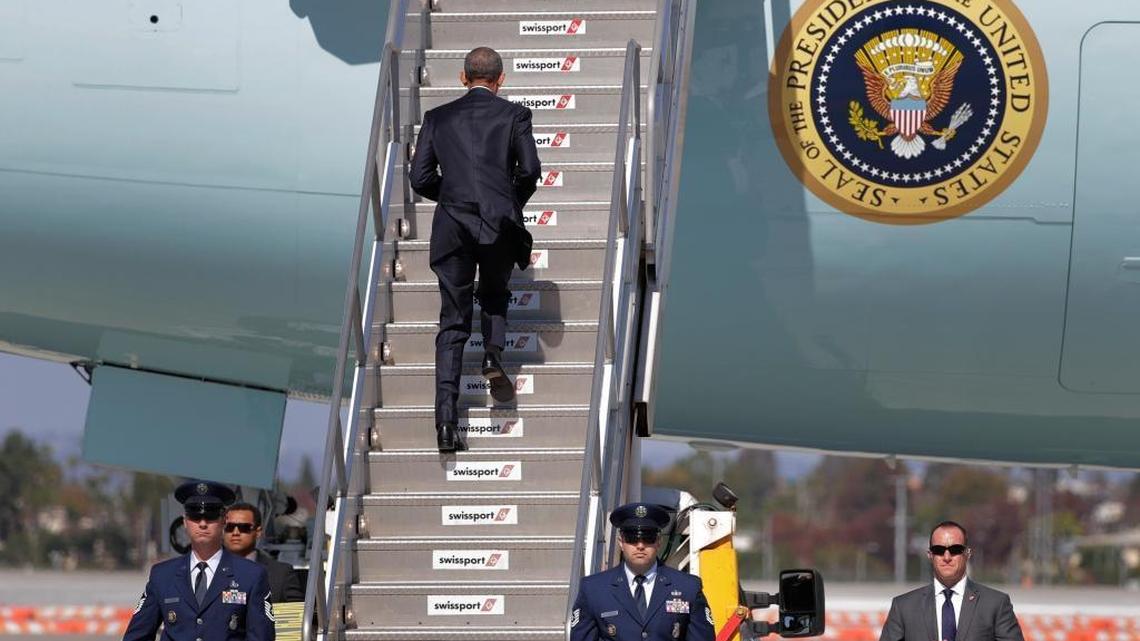 President Barack Obama boards Air Force One before his departure from the Los Angeles International Airport, Tuesday, Oct. 25, 2016, in Los Angeles, en route to Washington.
