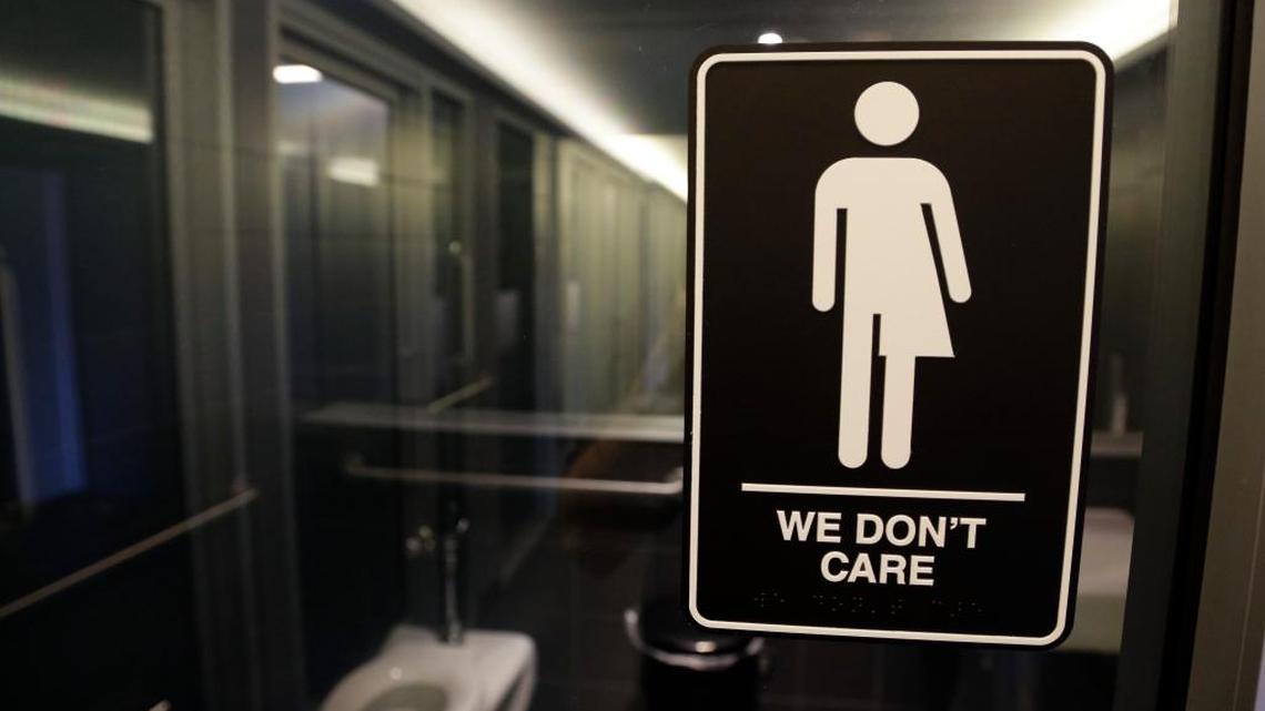 A sign outside a restroom at the 21c Museum Hotel in Durham, N.C. North Carolina is in a legal battle over a state law that requires transgender people to use the public restrooms matching the sexes on their birth certificates.