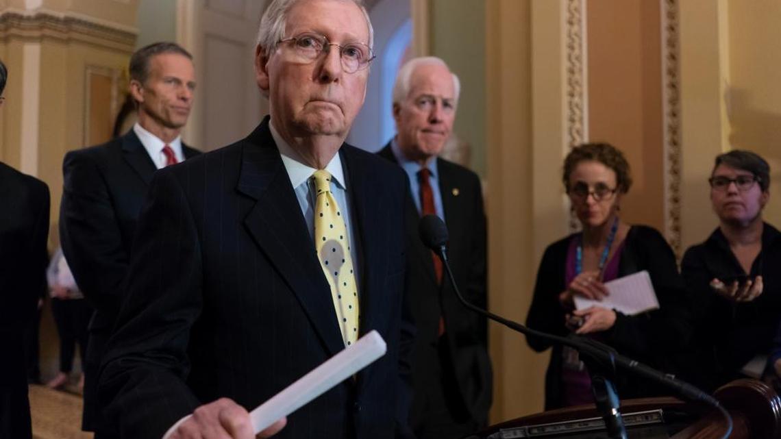 Senate Majority Leader Mitch McConnell, R-Ky., joined from left by Sen. John Thune, R-S.D., and Majority Whip John Cornyn, R-Texas, speaks to reporters following a closed-door strategy session on Capitol Hill in Washington Tuesday.
