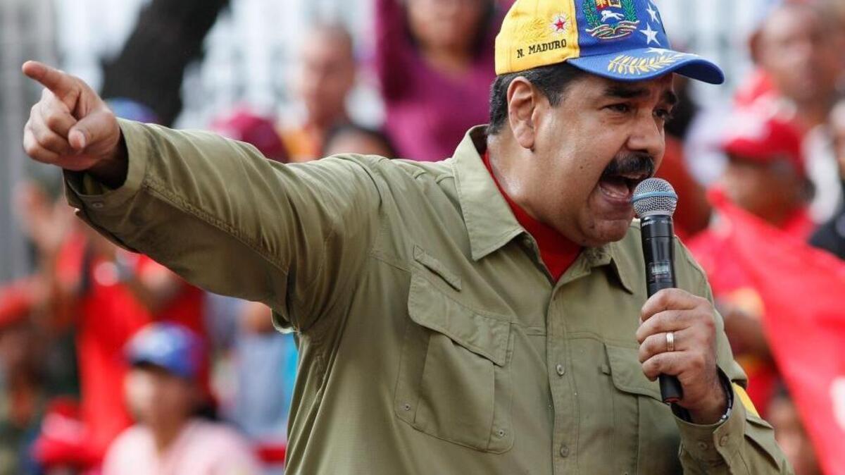 Venezuela's President Nicolas Maduro addresses supporters during a rally marking the anniversary of the 1992 failed coup led by late President Hugo Chavez in Caracas, Venezuela, Sunday, Feb. 4, 2018. Maduro will run for reelection in this year's presidential election.