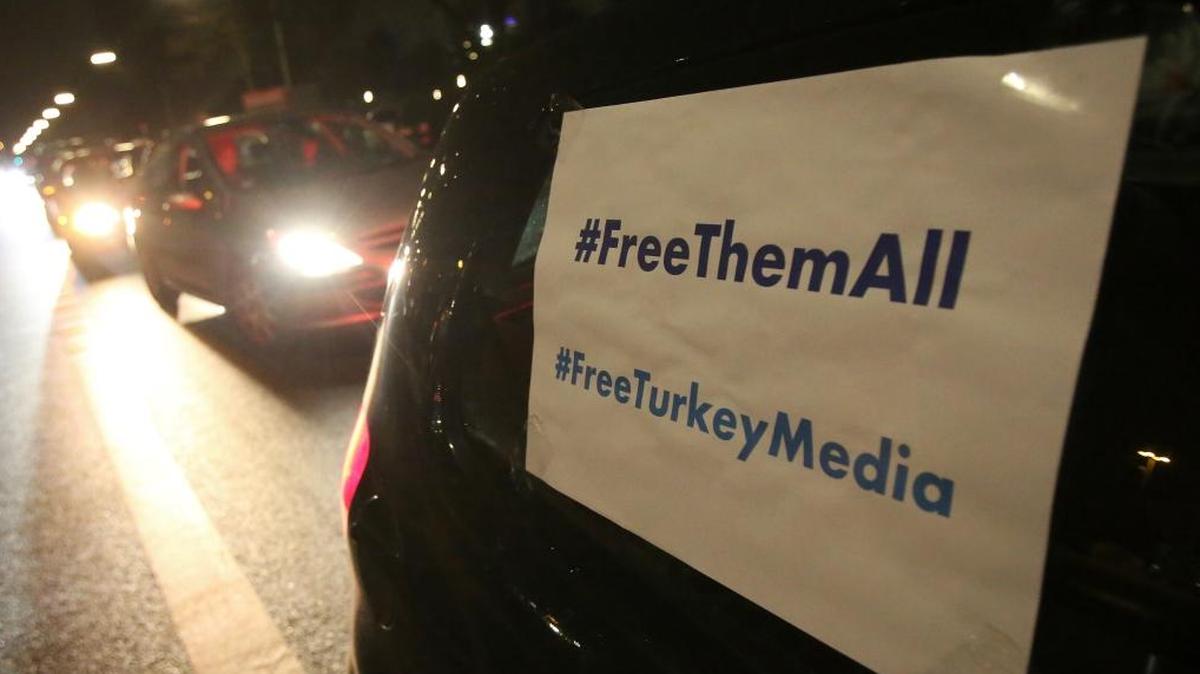 A signs is attached to a car which reads '#FreeThemAll' and 'FreeTurkeyMedia' as friends, colleagues and supporters of German-Turkish journalist Deniz Yucel, drive in a motorcade through the streets in Berlin, Germany, 16 February 2018. After spending one year in prison, Yucel, who works as a foreign correspondent for 'Die Welt' newspaper, was released from the correctional facility in Silivri near Istanbul. A court had ordered the release after the Turkish prosecution had submitted the indictment. Photo by: Bodo Marks/picture-alliance/dpa/AP Images