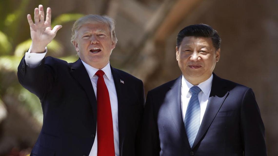 U.S. President Donald Trump, left, and Chinese President Xi Jinping pause for photographs in April at Mar-a-Lago in Palm Beach, Fla.