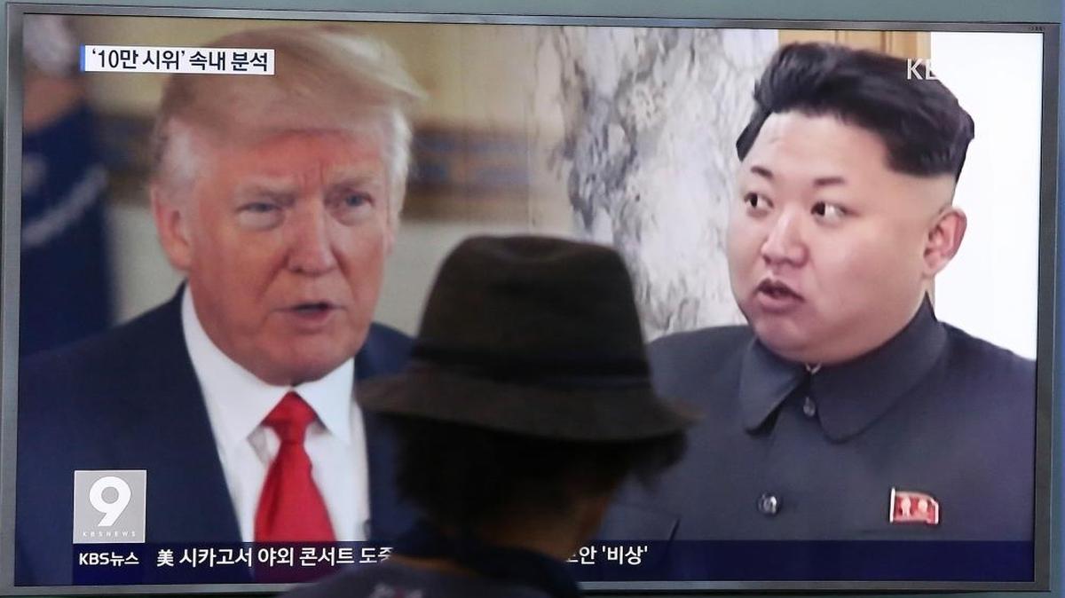 In this Thursday, Aug. 10, 2017, file photo, a man watches a television screen showing U.S. President Donald Trump, left, and North Korean leader Kim Jong Un during a news program at the Seoul Train Station in Seoul, South Korea. North Korea has announced a detailed plan to launch a salvo of ballistic missiles toward the U.S. Pacific territory of Guam, a major military hub and home to U.S. bombers. If carried out, it would be the North's most provocative missile launch to date.