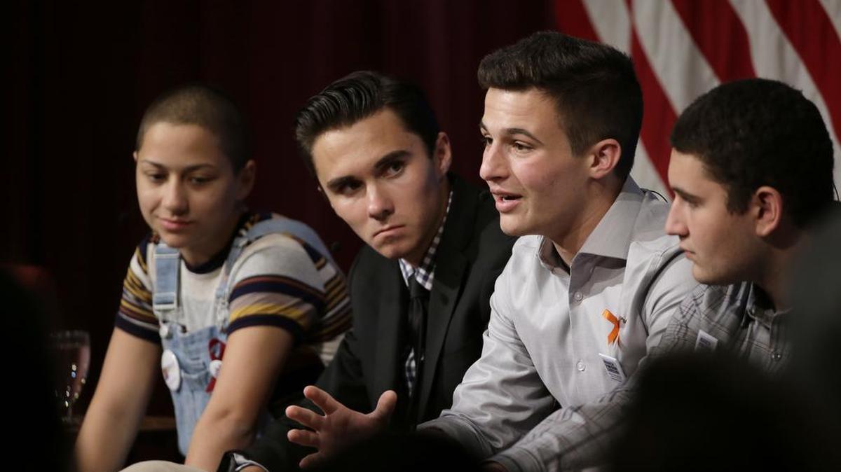 Marjory Stoneman Douglas High School students Emma Gonzalez, left, David Hogg, Cameron Kasky, and Alex Wind, participate in a panel discussion about guns, March 20, 2018, at Harvard Kennedy School's Institute of Politics, in Cambridge, Mass.