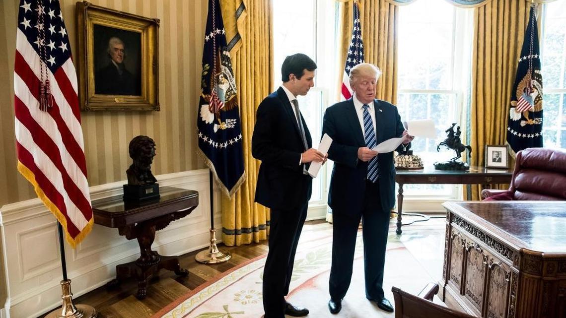 President Donald Trump speaks to White House Senior Adviser Jared Kushner in the Oval Office.