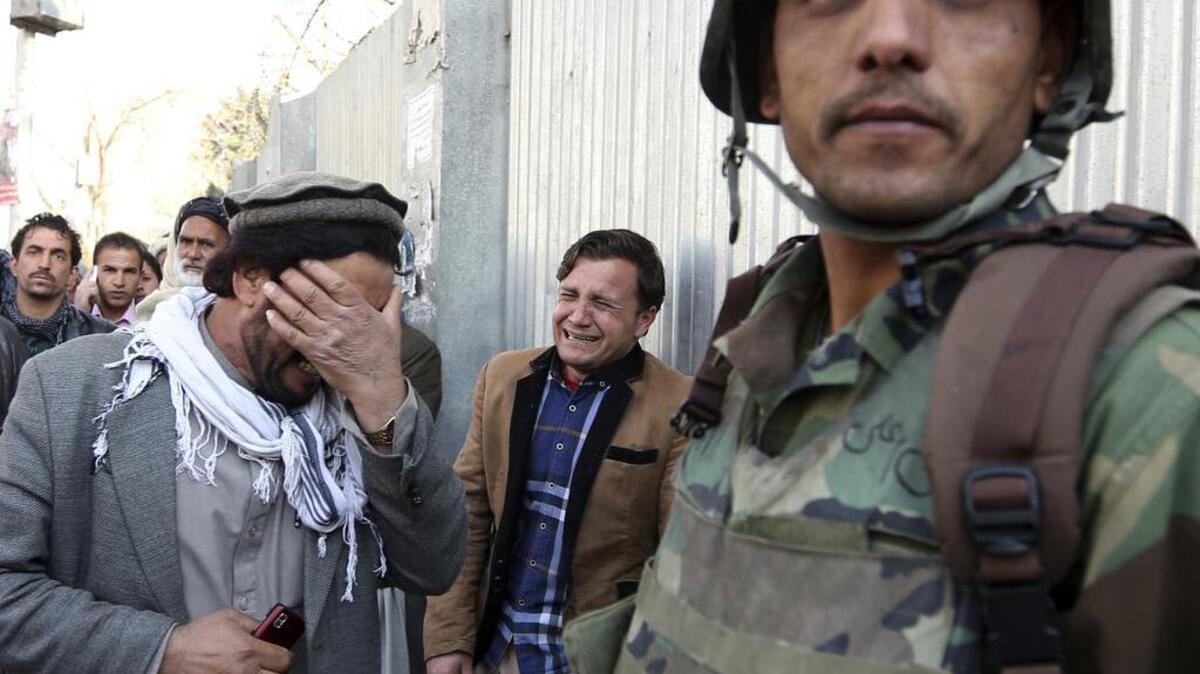Gunmen stormed a military hospital in Afghanistan's capital on March 8, killing at least four people and wounding more than 60.