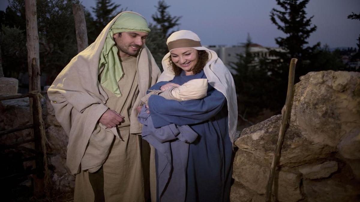 Christians play the parts of Joseph and Mary during a re-enactment of a Nativity scene of the birth of Jesus Christ as part of Christmas festivities at the Nazareth Village in the northern Israeli city of Nazareth, Tuesday, Dec. 22, 2015.