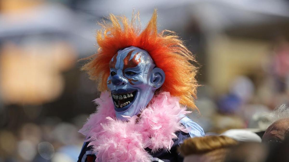 A fan dressed as a clown watches in the first half of an NFL football game between the Tennessee Titans and the Buffalo Bills Sunday, Oct. 11, 2015, in Nashville, Tenn.