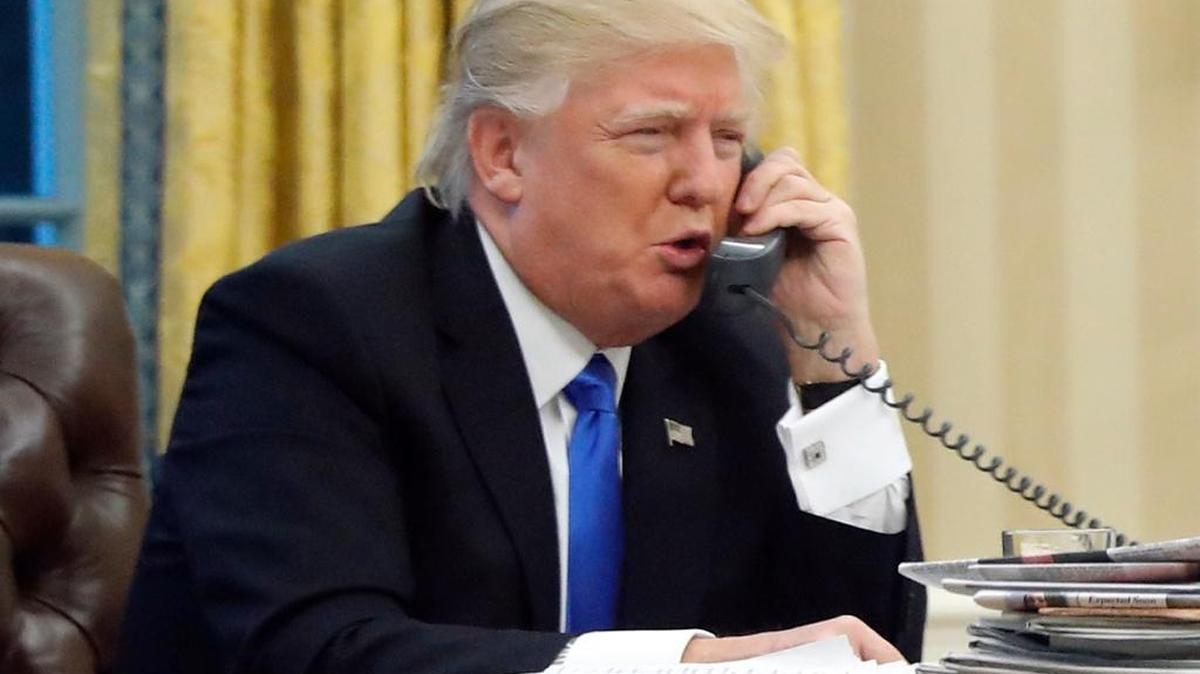 In this photo taken Jan. 28, 2017, President Donald Trump speaks on the phone with Australian Prime Minister Malcolm Turnbull in the Oval Office of the White House in Washington. Transcripts of President Donald Trump’s conversations with the leaders of Mexico and Australia in January offer new details on how the president parried with the leaders over the politics of the border wall and refugee policy, with random asides on subjects including drug abuse in New Hampshire.