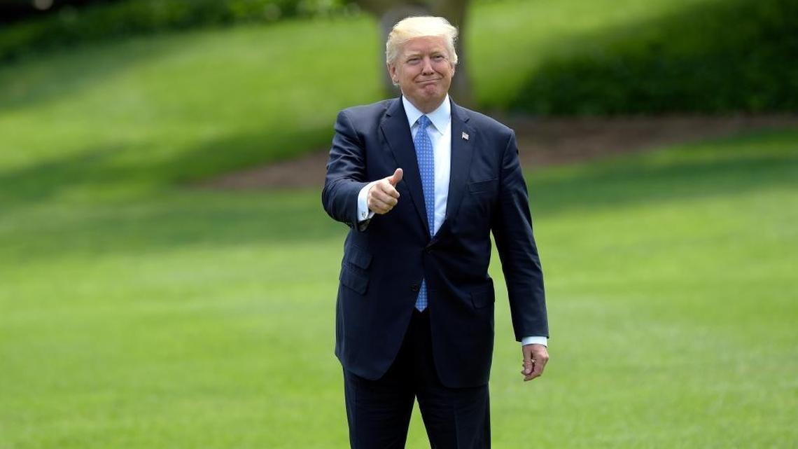 President Donald Trump gives a thumbs-up as he walks across the South Lawn of the White House in Washington, Friday, May 19, 2017, to board Marine One for a short trip to Andrews Air Force Base, Md. Trump was leaving for his first foreign trip, visiting Saudi Arabia, Israel, the Vatican and a pair of summits in Brussels and Sicily.