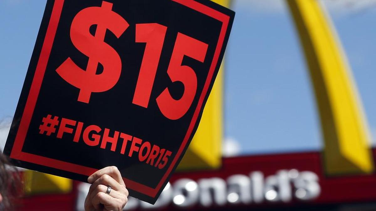 Supporters of a $15 minimum wage for fast food workers rally in front of a McDonald's in Albany, N.Y. in 2015.