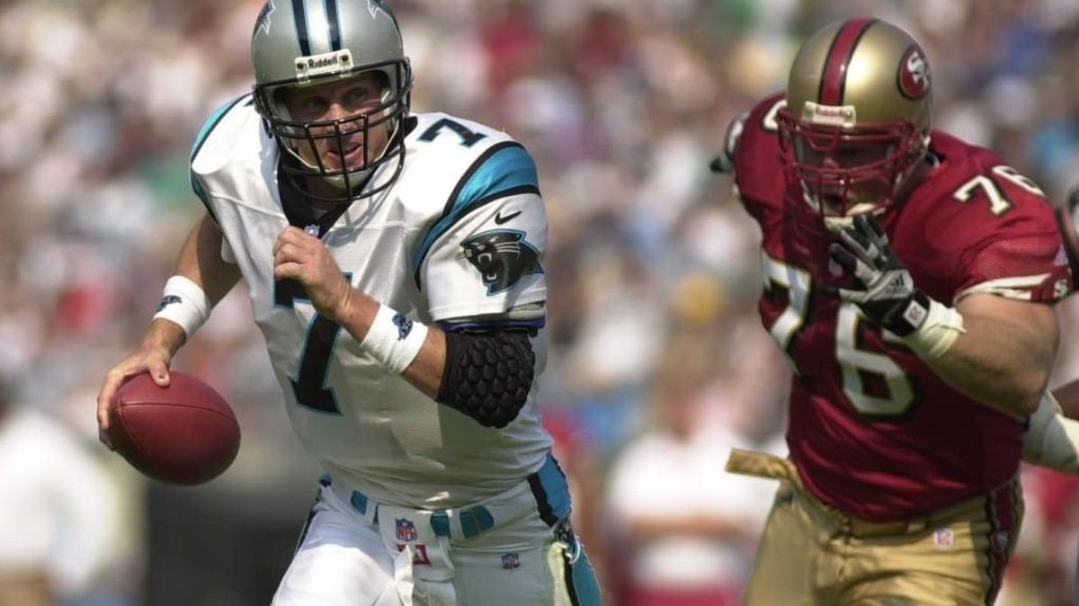 Nate Hobgood-Chittick, right, chases Panthers quarterback Steve Beuerlein in 2000. Hobgood-Chittick was with the San Francisco 49ers at the time.