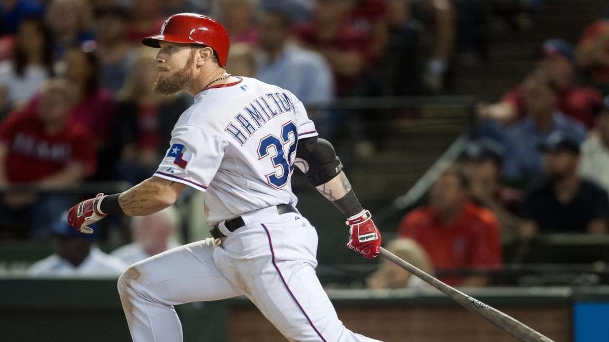 Josh Hamilton hits a sacrifice fly for the Rangers against the Angels on Oct. 1, 2015.