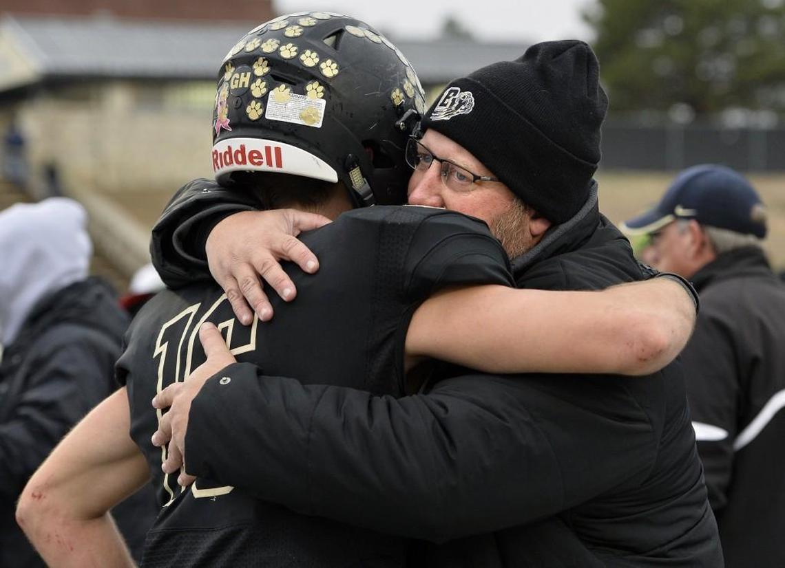 As head football coach at Blue Valley High, Eric Driskell, right, maintained a familial bond with players, students and others throughout the school community.