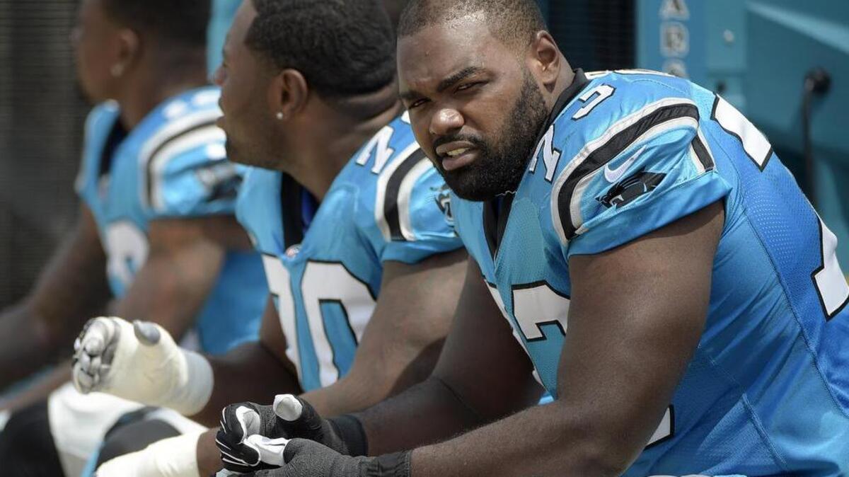 Former Carolina Panthers tackle Michael Oher, right, who faces misdemeanor charges of assaulting an Uber driver, has been sued in connection with the incident.