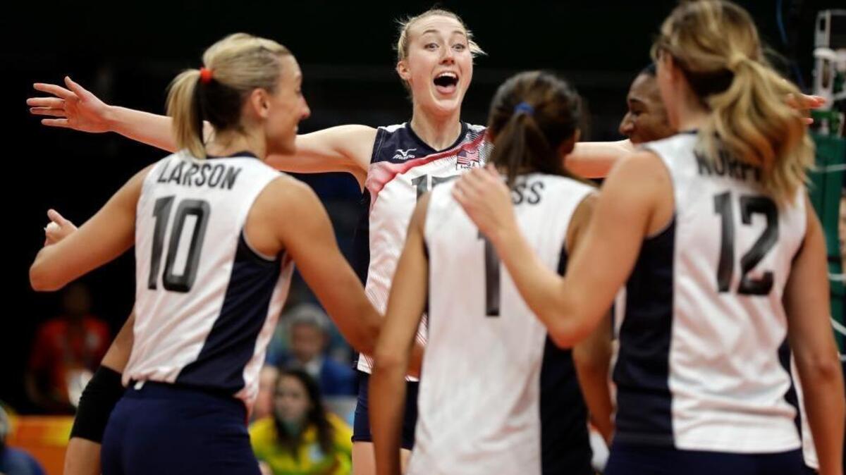 United States’ Kim Hill celebrates with teammates during a women's preliminary volleyball match against Puerto Rico on Aug. 6.