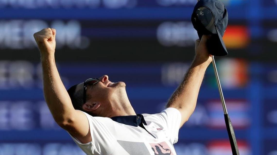 Justin Rose of Great Britain, wins the gold medal during the final round of the men's golf event at the 2016 Summer Olympics in Rio de Janeiro, Brazil, Sunday, Aug. 14, 2016.