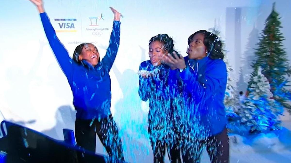 Nigerian boblsedders, from left, Ngozi Onwumere, Akuoma Omeoga and Seun Adigun play with fake snow during a media event in New York. The trio will represent Nigeria as the country fields its first-ever bobsled team at the Winter Olympics in Pyeongchang.