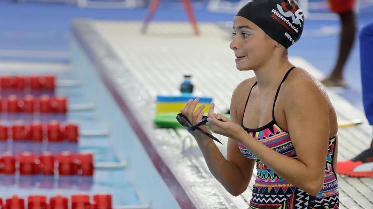 Olympic refugee team member Yusra Mardini prepares to swim laps Thursday at the Olympic Aquatics Stadium ahead of the Rio Olympics. Mardini is one of 10 athletes on the first Olympic refugee team, having fled war-torn Syria.